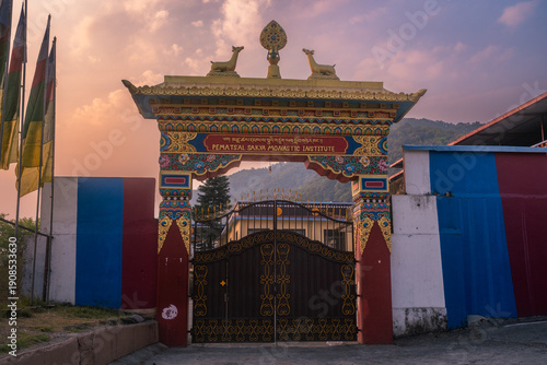 фотографія Morning view to the gate of Tibetan monastery with magical sunrise atmosphere near Pokhara, Nepal