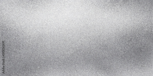 Gray brushed metal texture background with a rough steel surface and soft light