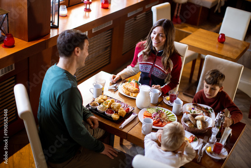 Family enjoys breakfast tog...
