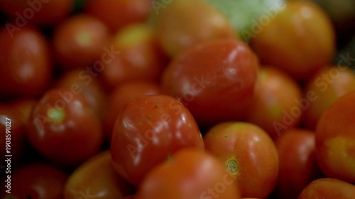 Full-Frame Close-Up of Vibrant Red and Orange Cherry Tomatoes in Market Display