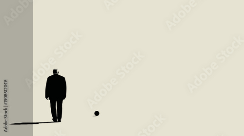Silhouette of a man walking towards a small sphere on a neutral background
