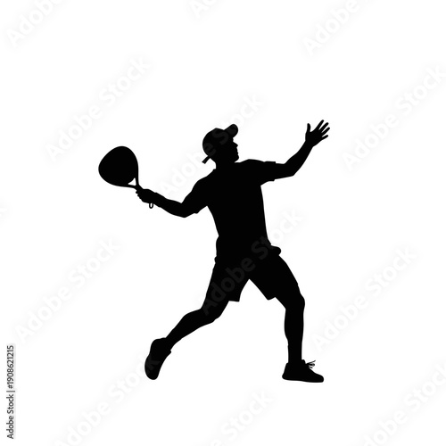 Silhouette of a Tennis Player Serving a Ball in Action