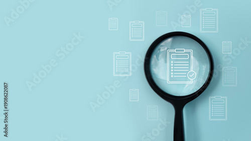 Bild auf Leinwand Magnifying glass over checklist document showing audit, compliance review, quality control, and business inspection