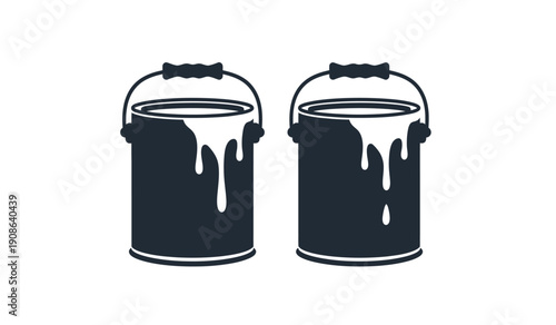 Two paint buckets with dripping paint