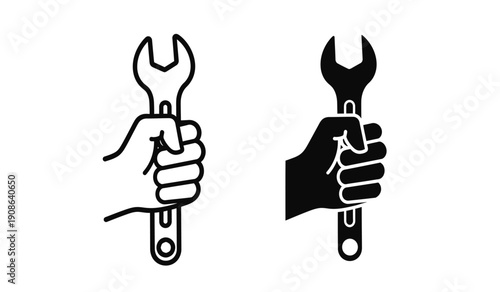 Two hands holding wrenches in black and white