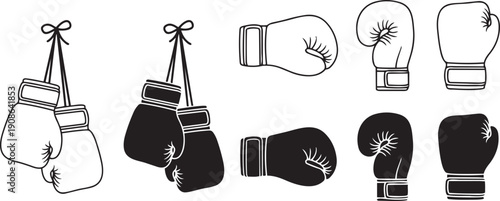 Boxing Gloves: A collection of boxing gloves in black and white, showcasing the equipment essential for the sport of boxing, ready for training or competition.