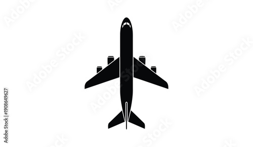 Black silhouette of an airplane flying from above view