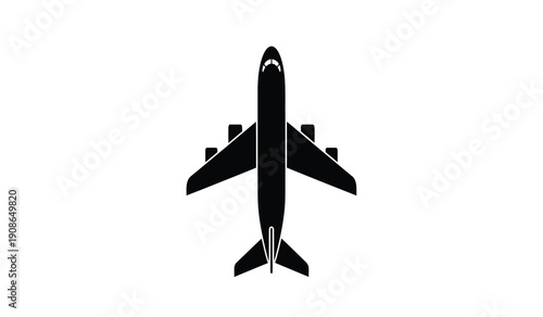 Black silhouette of an airplane flying from above view
