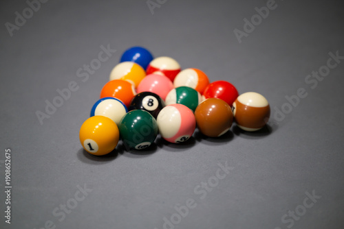 Racked Pool Balls on Gray Billiards Table
