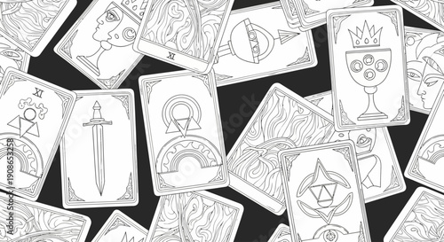 Collection of diverse tarot cards scattered on a dark surface viewed from directly above