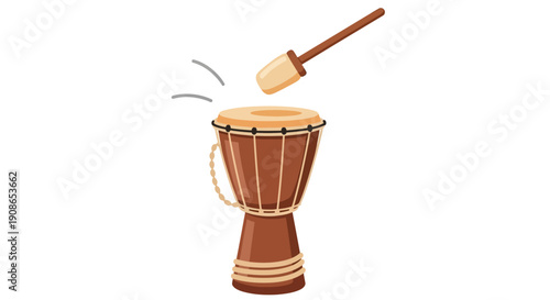 A djembe drum being played with a mallet in a cultural setting, viewed from the side.