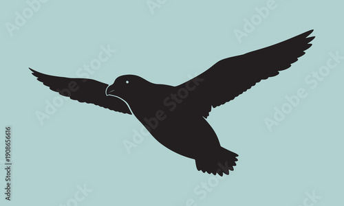 Flying petrel bird silhouette with wide wingspan over light blue background depicting oceanic wildlife seabird migration and coastal nature movement