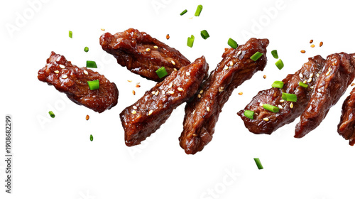 Delicious korean bbq beef with sesame seeds and green onion over transparent background