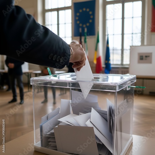 Main déposant un bulletin de vote dans une urne transparente lors d'une élection démocratique en France et en Europe