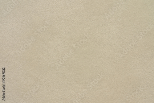 Beige suede leather texture background, natural soft fabric surface