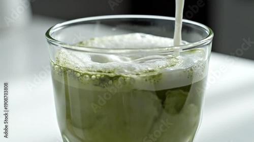 glass of water with matcha latte