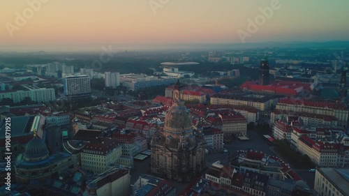 Aerial footage circling Dresden's Frauenkirche from right to left at dawn