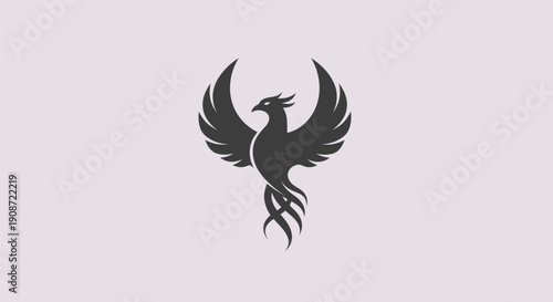 Stylized phoenix emblem on plain backdrop