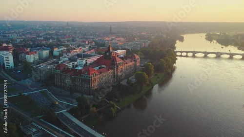 At dawn, the aerial camera pans from left to right, circling around Dresden's former Joint Ministerial Building of the Royal Saxon Ministries along the Laube river 