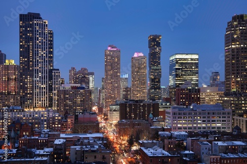 The modern Jersey City skyline during blue hour.