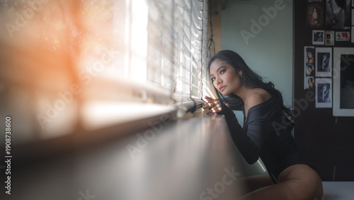 Canvas Print A teenage girl is using her smartphone to stream music to alleviate depression, heartbreak, and hopelessness