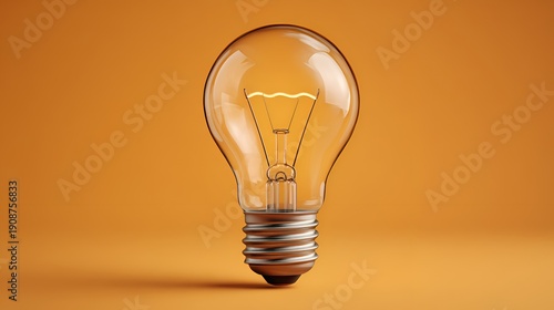 A single glowing lightbulb illuminates a vibrant orange backdrop, representing innovation and a bright idea in a simple studio setting.