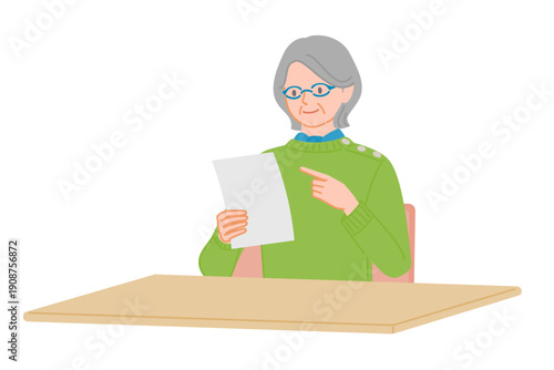 Senior woman checking document while holding paper and pointing