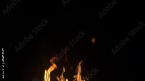 Beautiful flame on black background. Strong fire on black background. Yellow flames on black background.