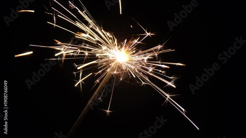 Bright sparklers glowing on black background. Glowing sparklers on black background.