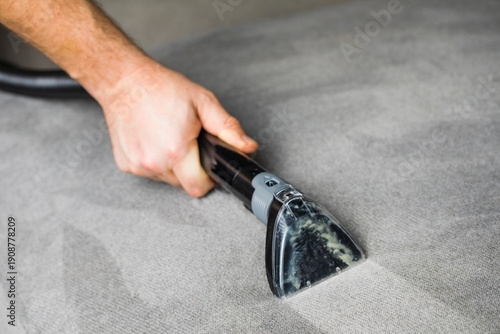 Slika na platnu Professional cleaning of the upholstery on a sofa