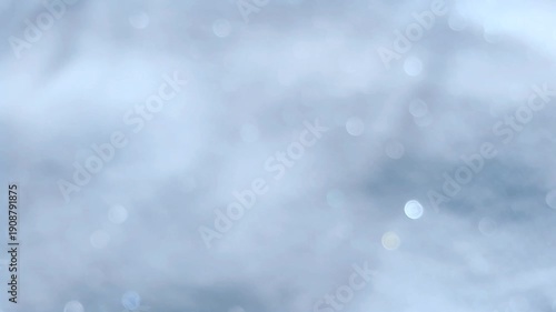 Snowflakes shimmer in the sun, sunny winter day, blurred background, bokeh