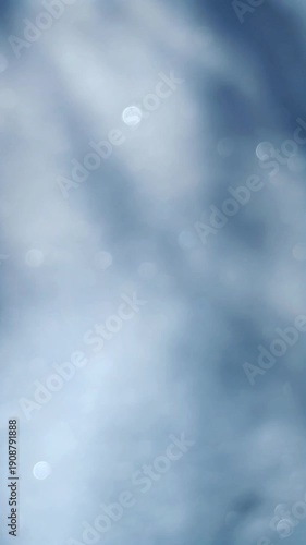 Snowflakes shimmer in the sun, sunny winter day, blurred background, bokeh