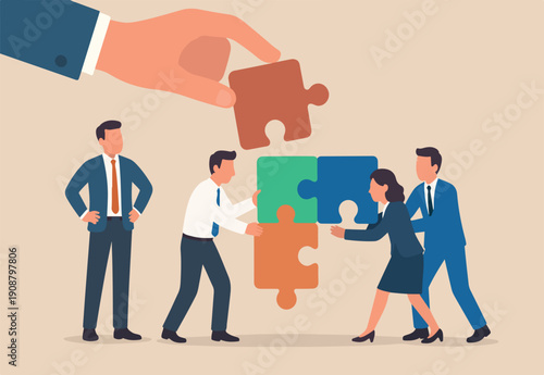  Build your team, leadership to develop teamwork or business partner, cooperate or collaborate for success, assist or help, giant businessman hand connect last jigsaw puzzle to office business team.