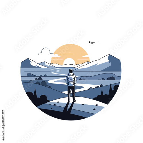 Man standing on hill overlooking scenic mountain landscape at sunrise