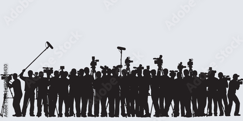 Silhouette of a crowd of photographers and videographers with cameras and equipment.