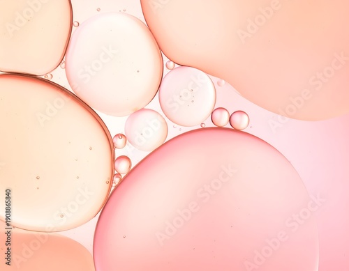 Close-up macro of pink and peach oil and water droplets