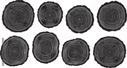 Eight black and white tree stump cross sections isolated