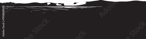 Silhouette of boats on a serene ocean at sunset