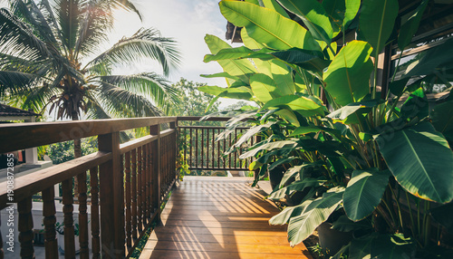 Tropical balcony with wooden floor and railing, featuring lush green banana plants and bright morning sunlight. Peaceful outdoor terrace for vacation and relaxation.