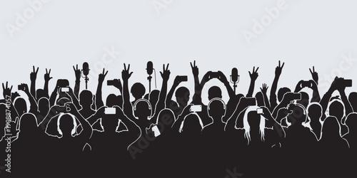 Crowd of people with hands raised, holding phones and microphones, at a concert or event.