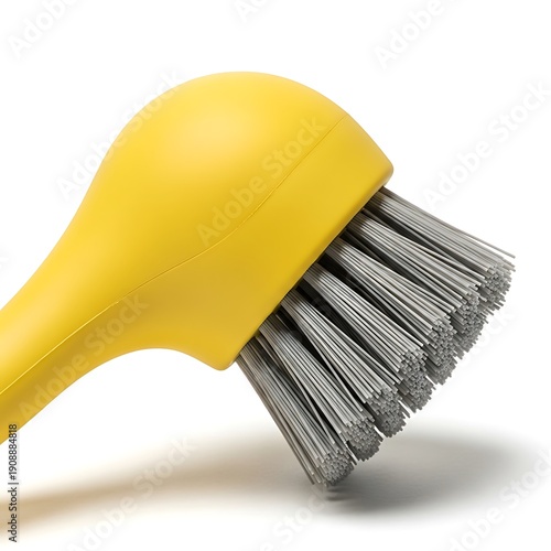 A yellow brush with metal bristles on a white background isolated on white background