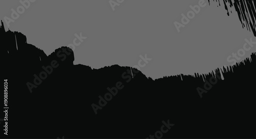 Dark Landscape with Silhouette Mountains against Grey Sky