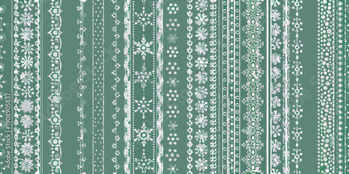 Vertical stripes of delicate white lace patterns on a green background