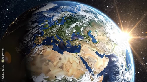 The earth from space with a beautiful sun rising over the horizon showing africa europe and asia