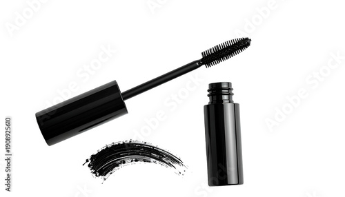 Black mascara tube and wand next to a smear of product. Isolated on black