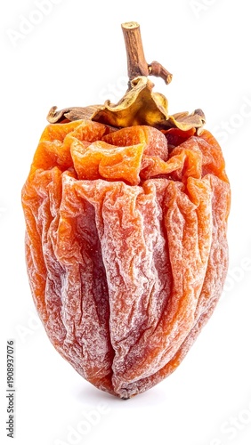 A dried, wrinkled orange fruit with stem