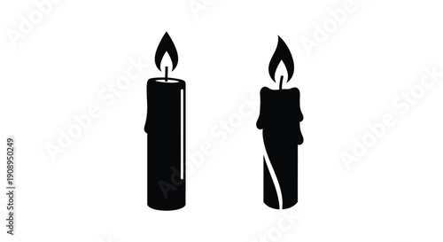 Two burning candles displayed in a striking black silhouette