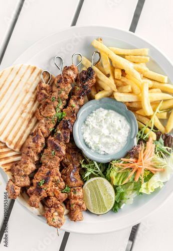 Wallpaper Mural BBQ chicken skewer gyros plate on white table in mykonos  restaurant greece Torontodigital.ca