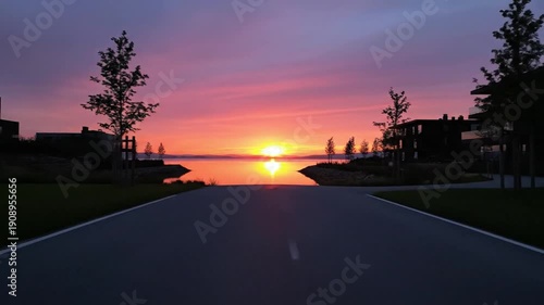 Wallpaper Mural Sunrise over serene lake with modern waterfront houses warm colors and calm reflections in the water Torontodigital.ca