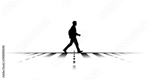 Silhouette of a man walking across a street.